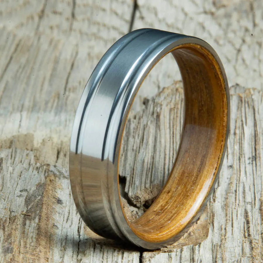 Double grooved satin titanium and Whiskey barrel wood ring
