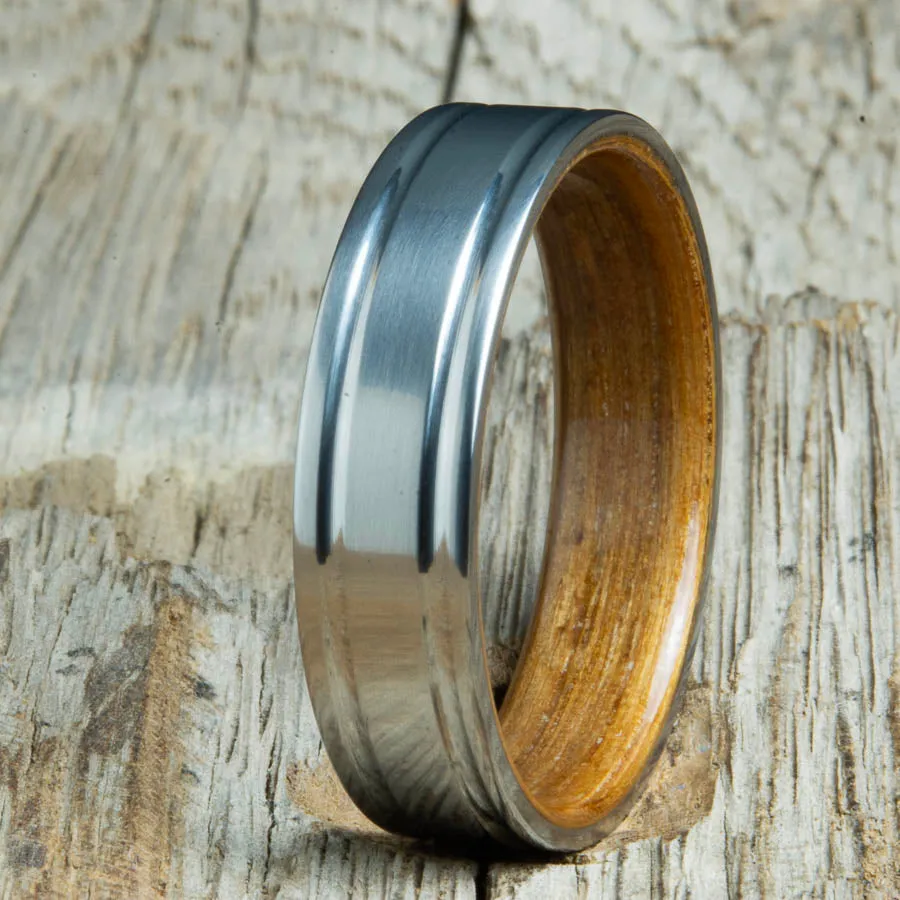 Double grooved satin titanium and Whiskey barrel wood ring