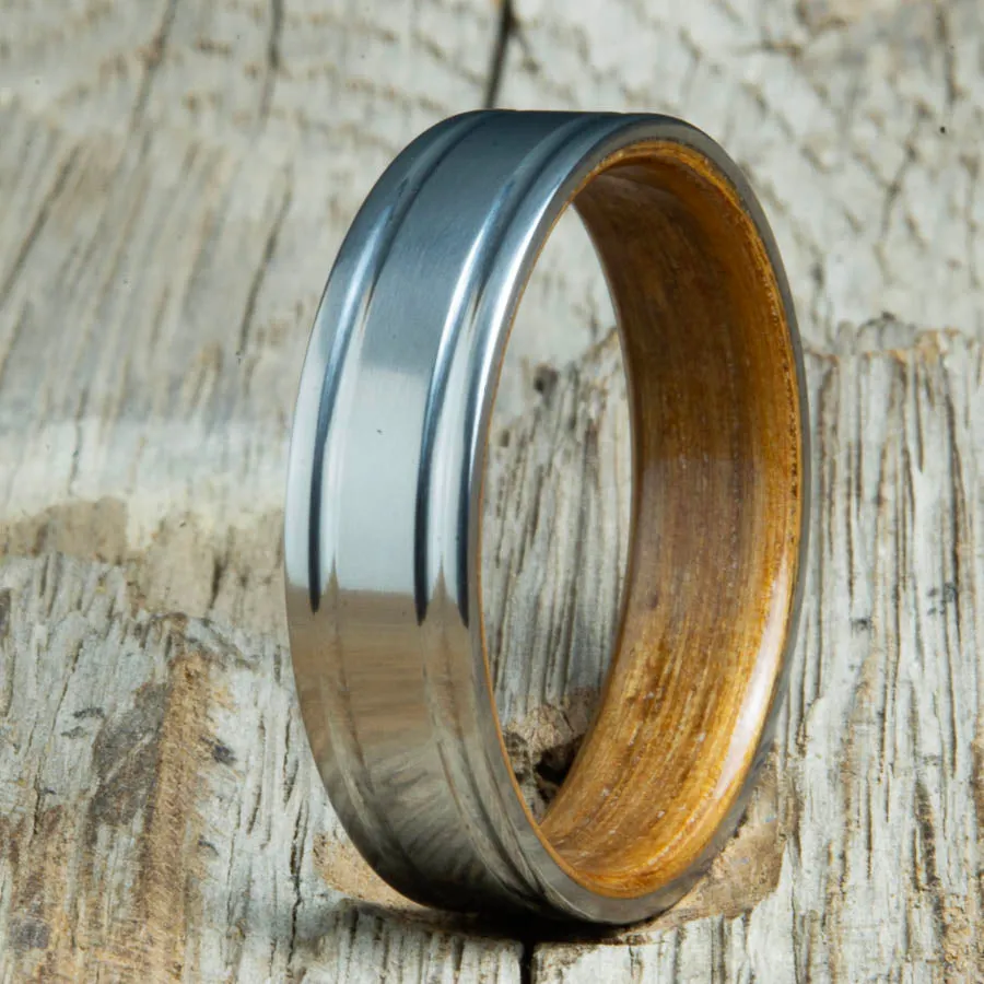 Double grooved satin titanium and Whiskey barrel wood ring