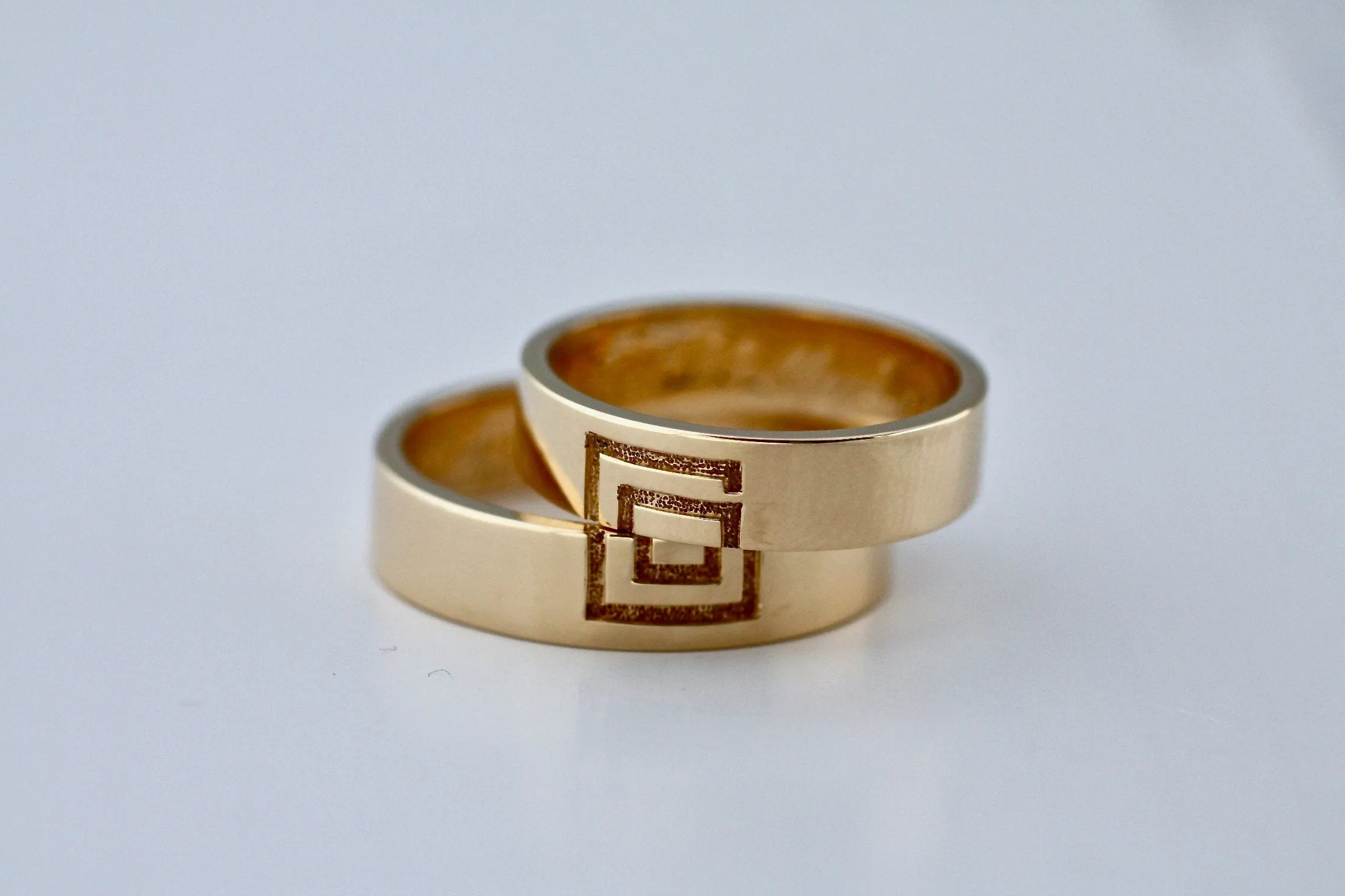 Meander sign Gold wedding bands for couples